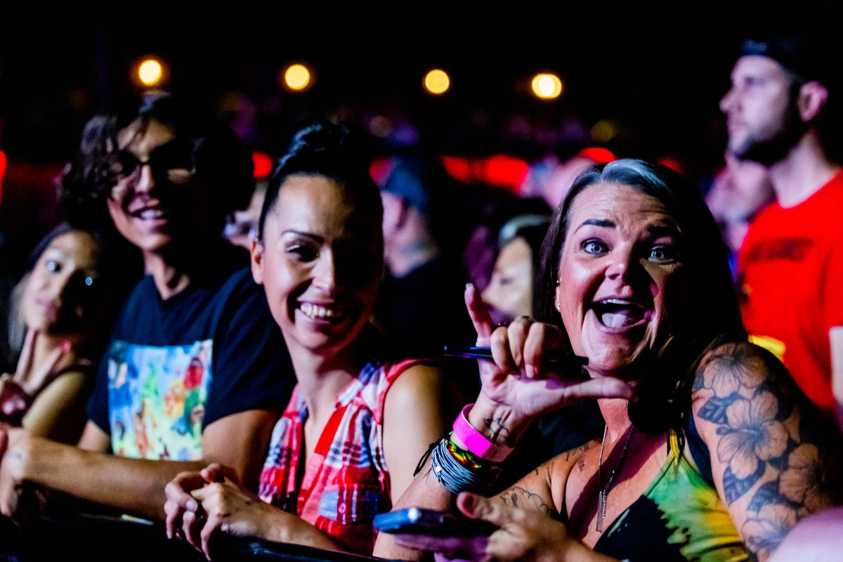 Friends enjoying a weekend concert at night - energy for late nights out