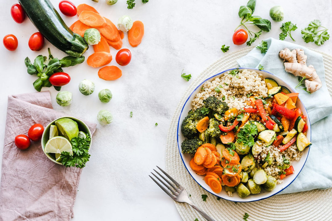 Colorful quinoa salad bowl with fresh vegetables and protein-rich foods on a table - DL-phenylalanine for mood from food and supplements