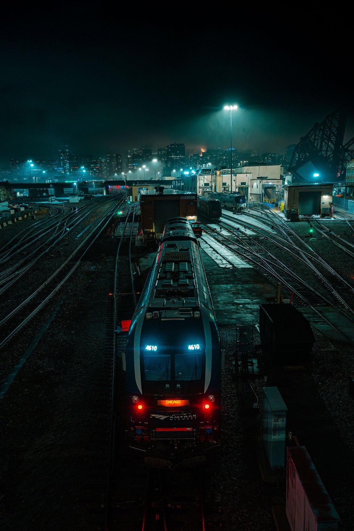 Train in a rail yard at night - staying sharp on irregular railroad schedules